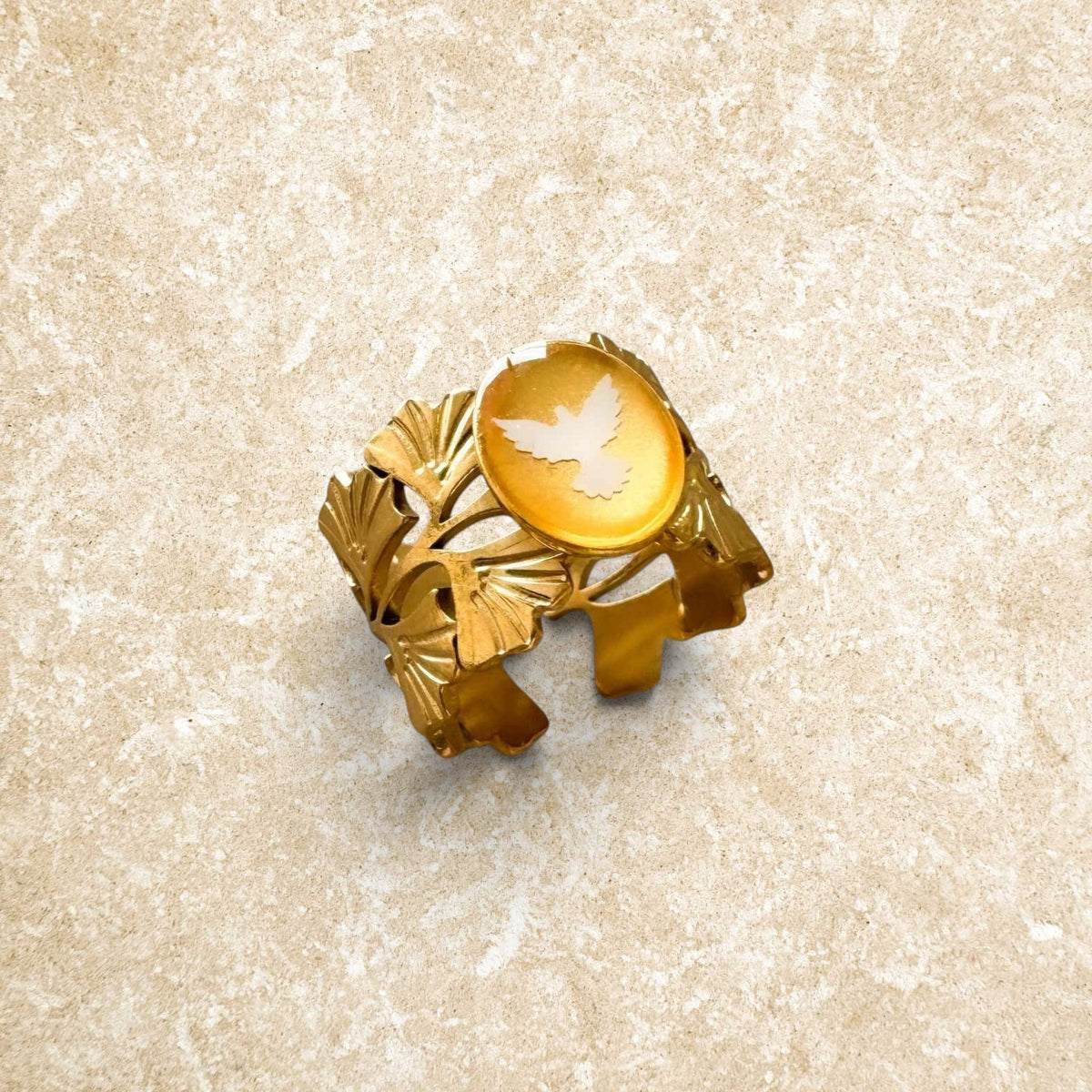 Nabert Creations Spiritus Fleur gold-plated steel ring with dove, ginkgo leaves, and gold leaf inclusion