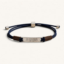 Load image into Gallery viewer, Blue and brown cord bracelet by Fleur Nabert Creations with an engraved zamak plaque inscribed with 'The Lord is My Strength'

