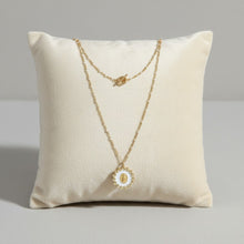Load image into Gallery viewer, Collier Fleur Nabert créations Reine du Ciel avec médaille miraculeuse dorée sur fond blanc nacré et chaîne en acier
