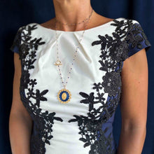 Load image into Gallery viewer, Collier sautoir Fleur Nabert créations avec médaille miraculeuse, couronne de fleurs dorées et perles en résine bleue
