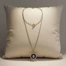 Load image into Gallery viewer, Collier sautoir Fleur Nabert créations double rang avec médaille miraculeuse bleue et dorée entourée de fleurs

